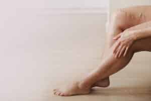 Older person's legs after seeking treatment for venous leg ulcers in Portland, OR